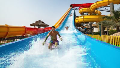 Families enjoying thrilling water slides at Water Park Dubai Families enjoying thrilling water slides at Water Park Dubai